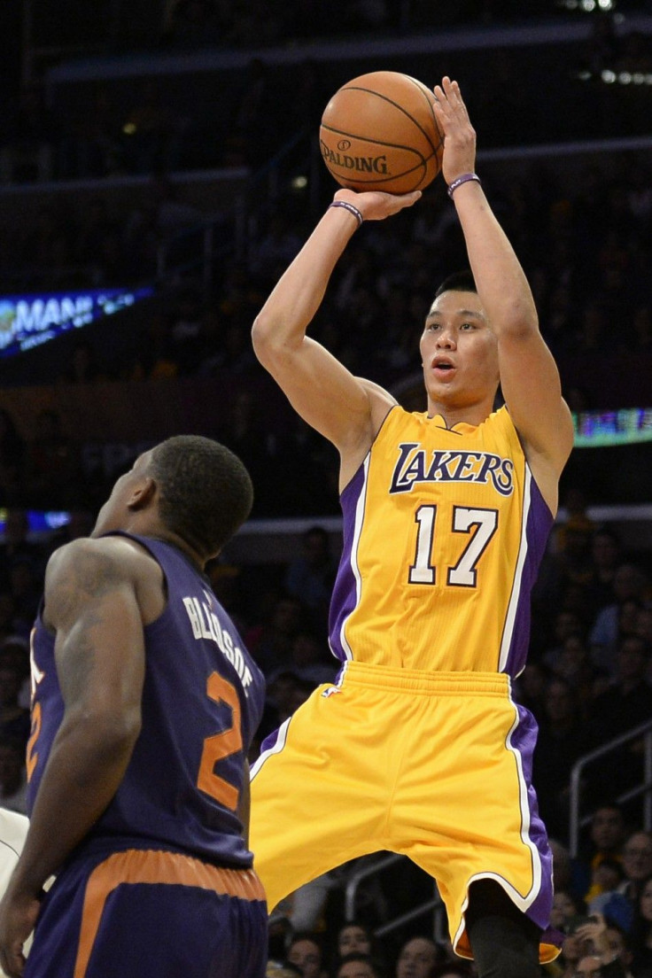 Los Angeles Lakers guard Jeremy Lin (17) shoots the basketball against Phoenix Suns guard Eric Bledsoe (2) during the second half at Staples Center.
