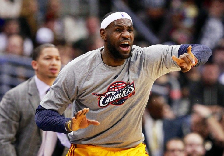 Cleveland Cavaliers forward LeBron James (23) reacts from the sidelines in the first quarter against the Denver Nuggets at the Pepsi Center.