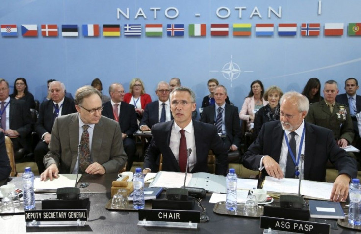 New NATO Secretary General Jens Stoltenberg (C) of Norway chairs his first meeting at the Alliance headquarters in Brussels October 1, 2014. REUTERS/Francois Lenoir