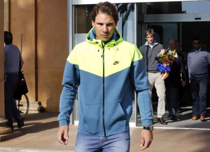 Spanish tennis player Rafael Nadal leaves the hospital after appendicitis surgery in Barcelona November 5, 2014. REUTERS/Gustau Nacarino