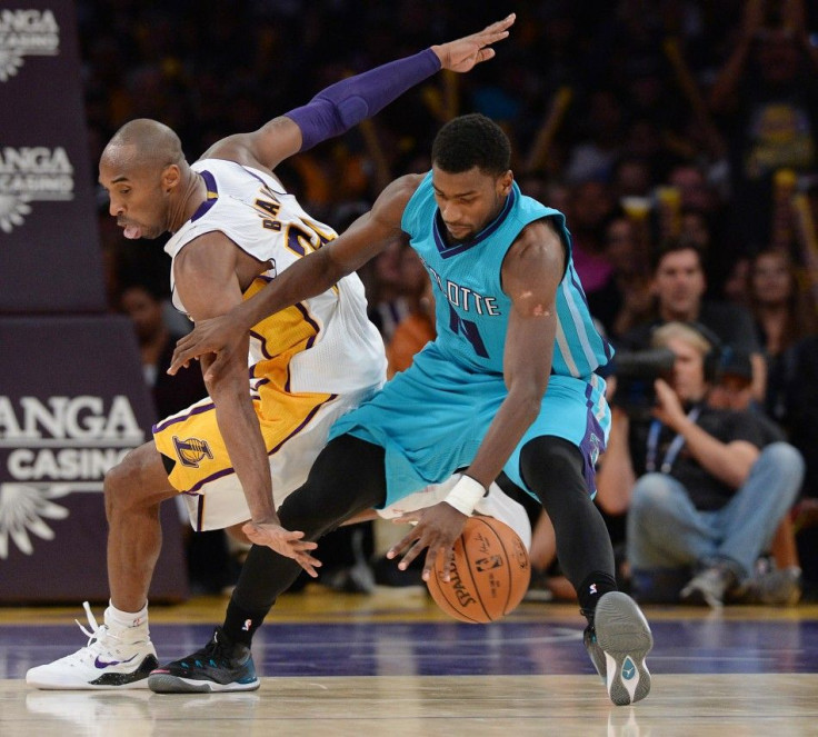 Nov 9, 2014; Los Angeles, CA, USA; Los Angeles Lakers guard Kobe Bryant (24) defends Charlotte Hornets forward Michael Kidd-Gilchrist (14) in the second half of the game at Staples Center. Lakers won 107-92