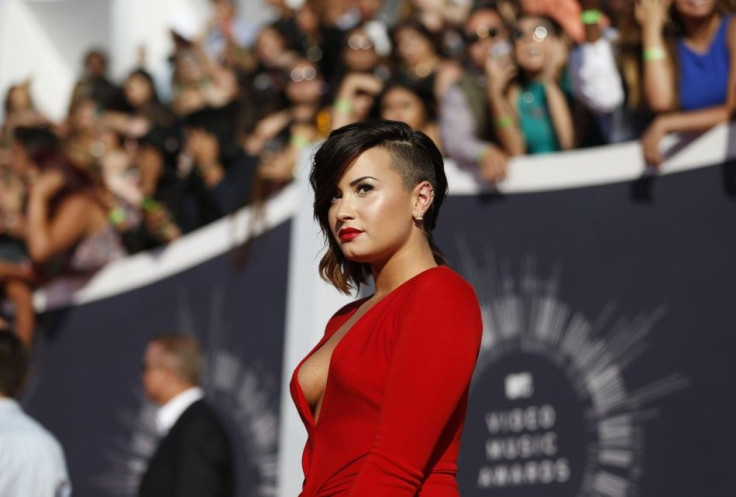 Demi Lovato arrives at the 2014 MTV Music Video Awards in Inglewood, California