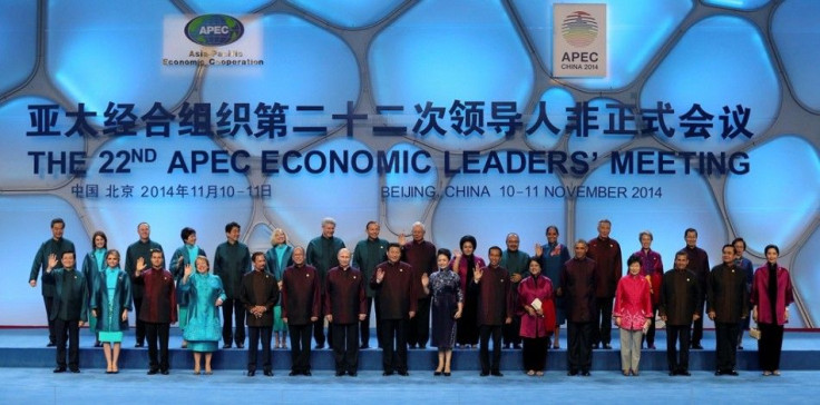 Asia Pacific Economic Cooperation (APEC) nations&#039; leaders and spouses pose for a family photo at Beijing National Aquatics Center