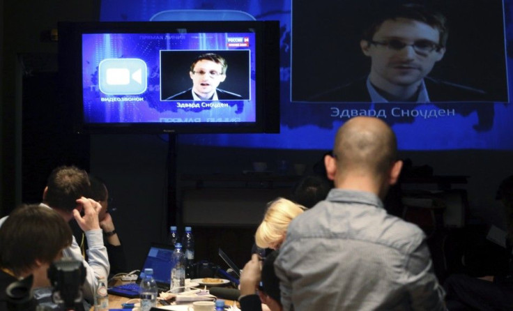 Journalists Listen To Former U.S. Spy Agency NSA Contractor Edward Snowden