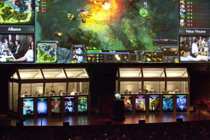 &quot;The Alliance&quot; (L) battles &quot;Natus Vincere&quot; (R) during &quot;The International&quot; Dota 2 video game competition in Seattle, Washington August 11, 2013. Sixteen teams from 12 countries battled for some $2.9 million in prize money, wit