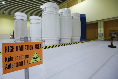 A sign that reads 'High Radiation Area - Avoid unnecessary stay!!!' is pictured in front of Castor nuclear waste containers (Cask for Storage and Transport of Radioactive material) at the ZWILAG interim storage facility for radioactive waste in 
