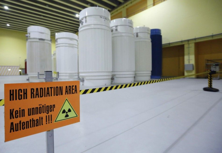 A sign that reads 'High Radiation Area - Avoid unnecessary stay!!!' is pictured in front of Castor nuclear waste containers (Cask for Storage and Transport of Radioactive material) at the ZWILAG interim storage facility for radioactive waste in 