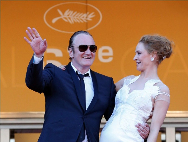 Director Quentin Tarantino (L) and actress Uma Thurman pose on the red carpet