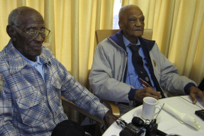 107-year old Richard Overton (L), sits with fellow centenarian and World War II veteran Elmer Hill as they met for the first time at the Emeritus at Parmer Woods Senior Living Center in Austin, Texas, on December 13, 2013.