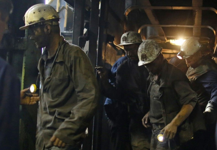 Trapped coal miners leave after they were rescued at the Raspotocje coal mine in Zenica September 5, 2014. Five Bosnian miners were confirmed dead on Friday, a day after an earthquake triggered a collapse at the mine, as emergency teams helped 29 others t