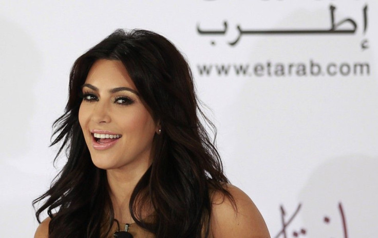 TV personality Kim Kardashian smiles during a news conference in Dubai