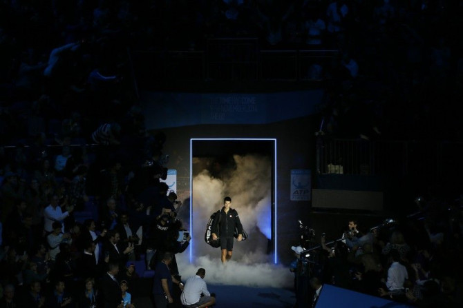 Novak Djokovic of Serbia arrives on court before his tennis match against Marin Cilic of Croatia at the ATP World Tour finals at the O2 Arena in London November 10, 2014. REUTERS/Stefan Wermuth