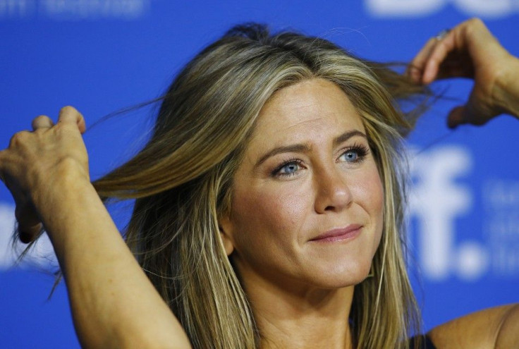 Jennifer Aniston plays with her hair at the &quot;Cake&quot; news conference at the Toronto International Film Festival (TIFF) in Toronto