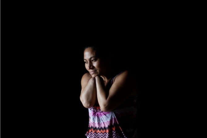 Angelica Maribel Murillo, 37, poses for a photograph at her home in the La Nueva Australia neighbourhood in Tegucigalpa