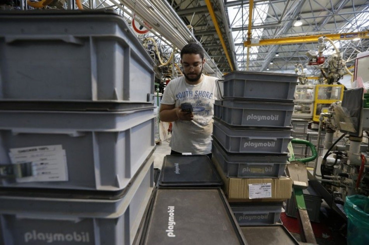 A worker makes an inventory of crates containing Playmobil figures at the Playmobil Malta factory in the Hal Far Industrial Estate outside Valletta April 11, 2014.