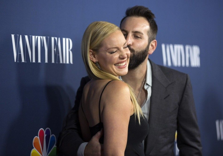 Actress Katherine Heigl from the television series "State of Affairs" gets a kiss from her husband Josh Kelley