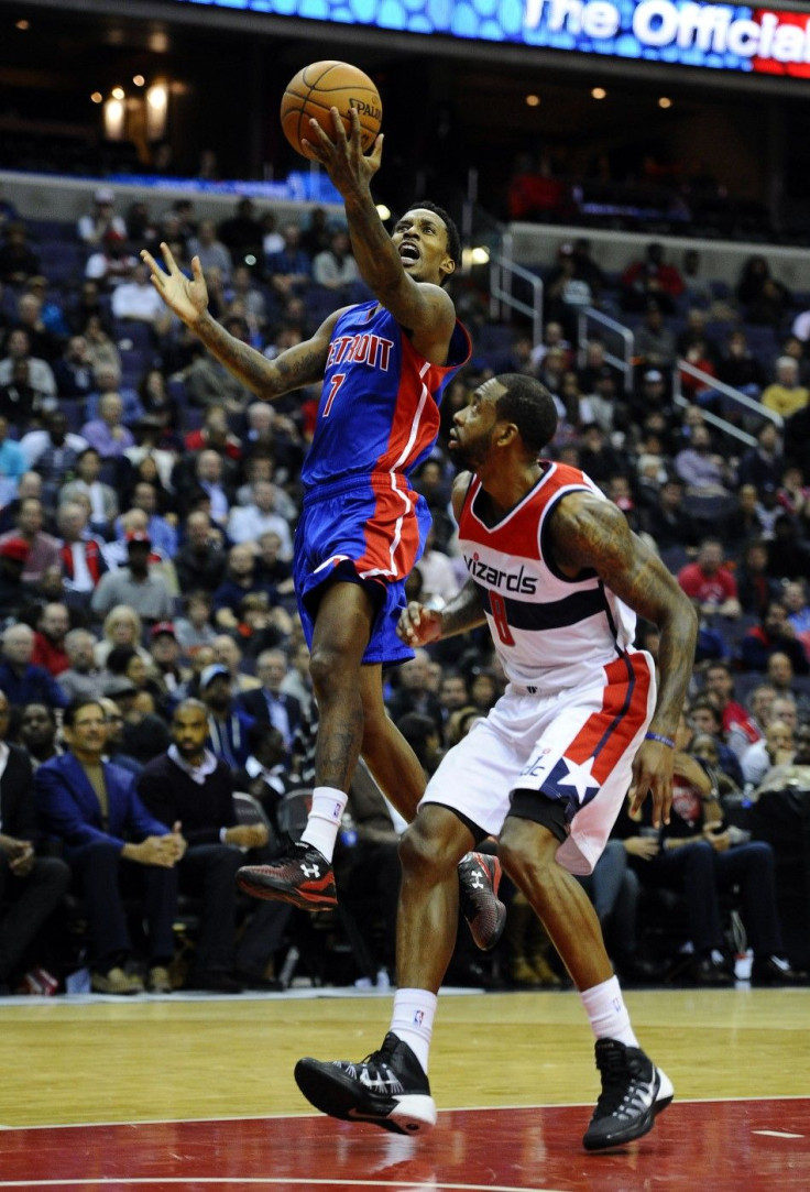 Nov 12, 2014; Washington, DC, USA; Detroit Pistons guard Brandon Jennings (7) shoots a layup as Washington Wizards forward Rasual Butler (8) looks on during the second half at Verizon Center. The Wizards won 107 - 103.