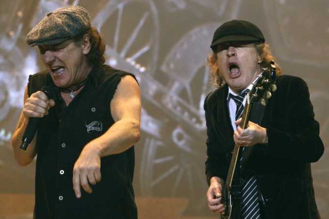 AC/DC lead vocalist Brian Johnson (L) and Angus Young performs at the O2 Millennium Dome stadium in London April 14, 2009.