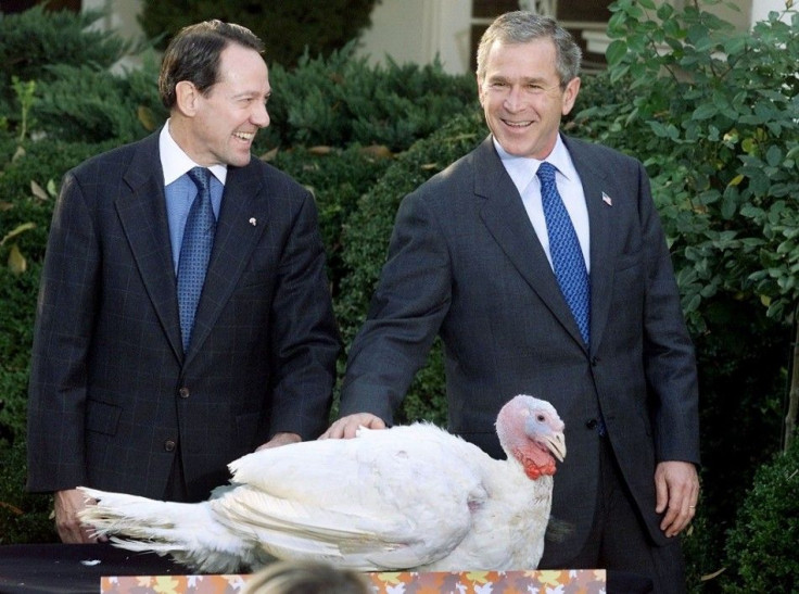 U.S. President George W. Bush pets a turkey, named &quot;Liberty,&quot; after announcing the bird will not be part of the first family's Thanksgiving dinner, during the traditional pardoning ceremony in the Rose Garden of the White House, November 19, 200