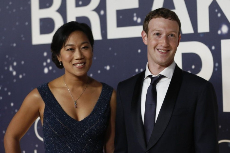 Mark Zuckerberg (R), founder and CEO of Facebook, and wife Priscilla Chan arrive on the red carpet during the 2nd annual Breakthrough Prize Award in Mountain View, California November 9, 2014.