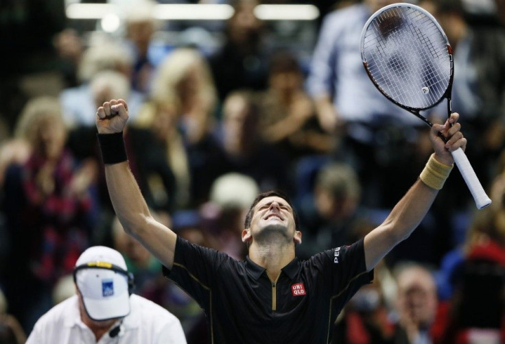 Novak Djokovic celebrates winning his tennis match against Tomas Berdych