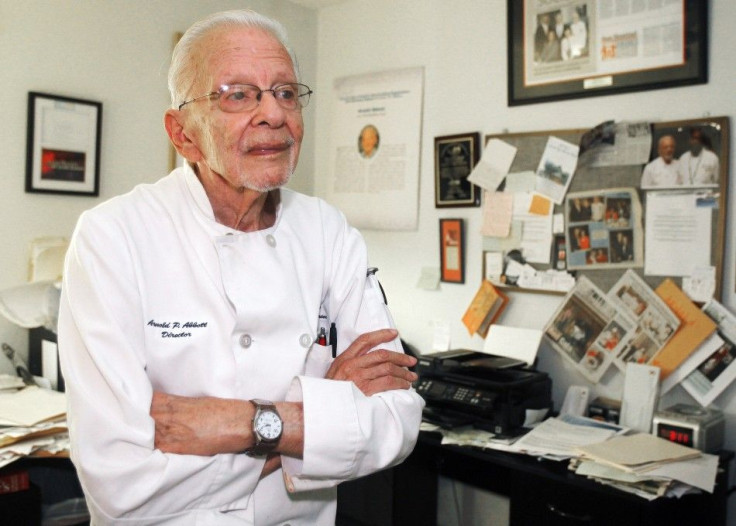 Arnold P. Abbott, president of the Maureen A. Abbott Love Thy Neighbor Fund, Inc., and culinary skills training program, organisations that feed and educate the homeless, poses in the office area of his home in Oakland Park, Florida, November 6, 2014.