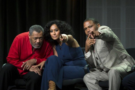 Cast member and executive producer Anthony Anderson (R) gestures next to co-stars Laurence Fishburne (L) and Tracee Ellis Ross