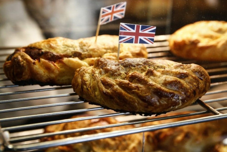 Pastries are pictured with Union Jack flags in them to celebrate the arrival of Britain's Prince Charles and Camilla, Duchess of Cornwall, to a farmers' market in Halifax, Nova Scotia, May 19, 2014. The royal couple are on a four-day visit to Canada.