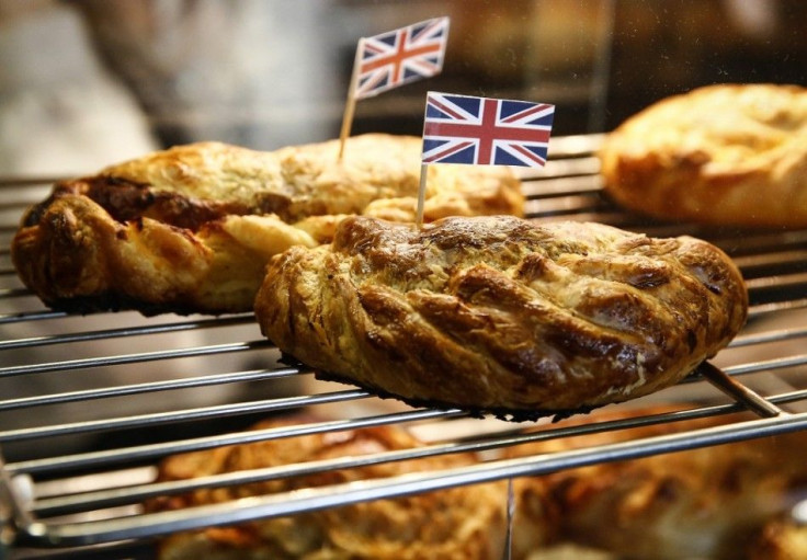 Pastries are pictured with Union Jack flags in them to celebrate the arrival of Britain's Prince Charles and Camilla, Duchess of Cornwall, to a farmers' market in Halifax, Nova Scotia, May 19, 2014. The royal couple are on a four-day visit to Canada.