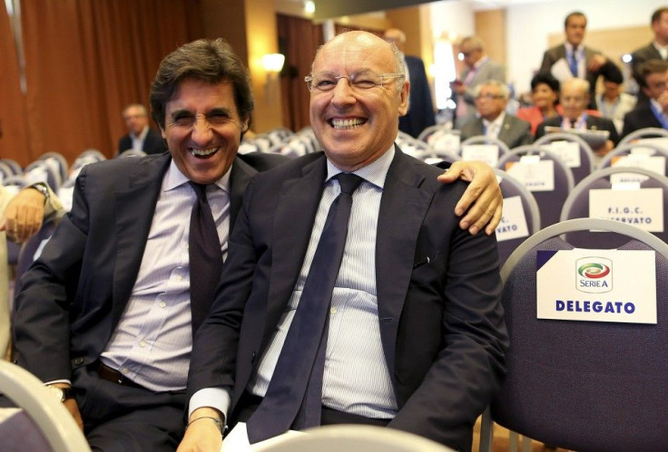 Juventus Sporting Director Giuseppe Marotta (R) and Torino president Urbano Cairo smile as they arrive at an election for the Italian Football Federation (FIGC) presidency in Rome August 11, 2014. FIGC vice-president Carlo Tavecchio faces former AC Milan 