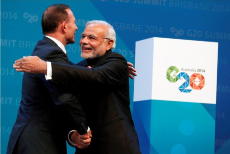 Australian Prime Minister Tony Abbott embraces India&#039;s Prime Minister Narendra Modi