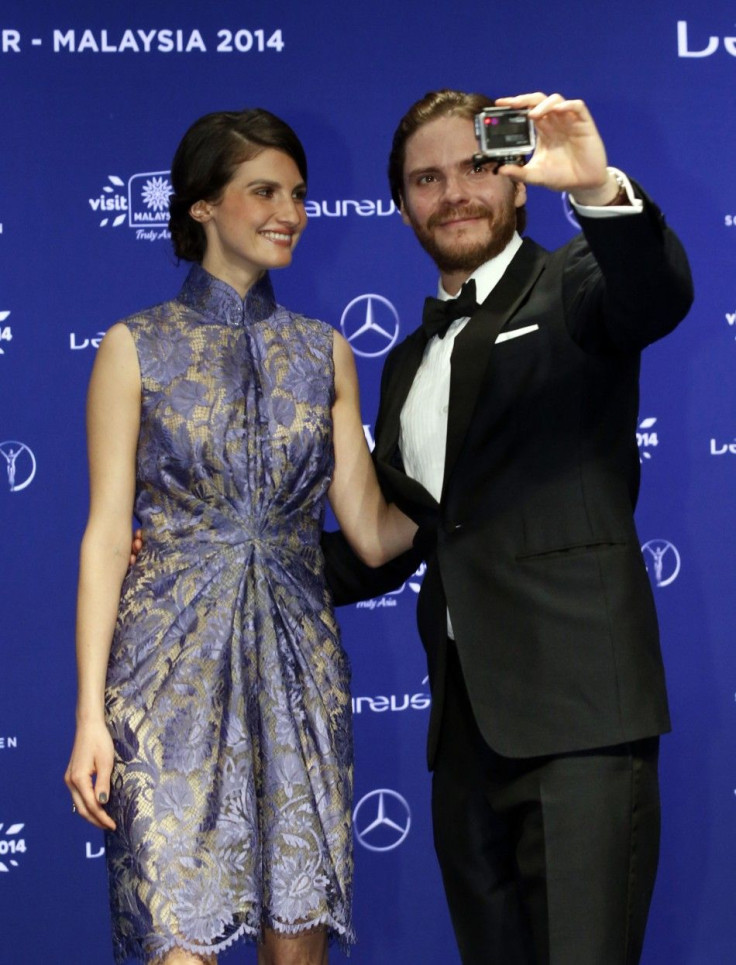 Actor Daniel Bruhl and his girlfriend, model Felicitas Rombold, arrive for the Laureus Sports Awards in Kuala Lumpur March 26, 2014.