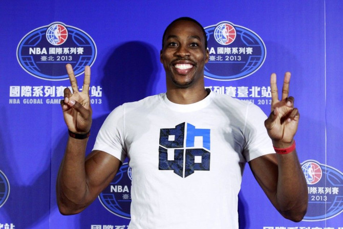 NBA Houston Rockets&#039; Dwight Howard poses for pictures during a news conference in Taipei October 11, 2013.