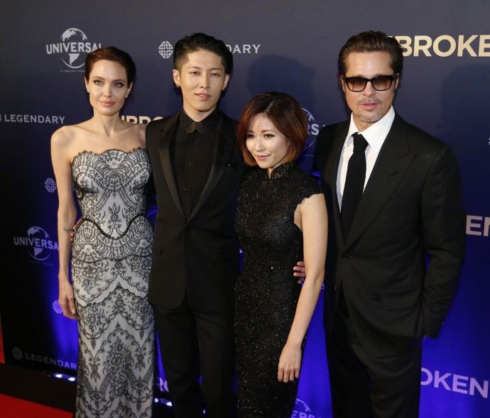 L-R Angelina Jolie, cast member Miyavi, his wife Melody Ishihara and Brad Pitt pose at the world premiere of Jolies film quotUnbrokenquot at the State Theatre in Sydney, November 17, 2014. The war drama, based on the life of World War Two American 