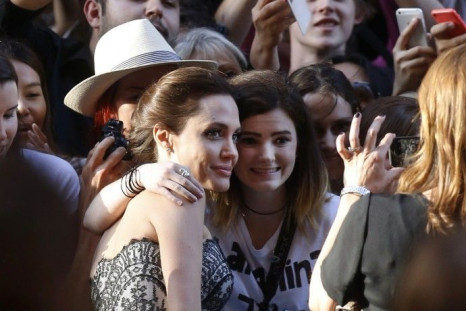 Angelina Jolie has her picture taken with fans at the world premiere of her film &quot;Unbroken&quot; at the State Theatre in Sydney, November 17, 2014. The war drama, based on the life of World War Two American prisoner of war Louis Zamperini, was direct