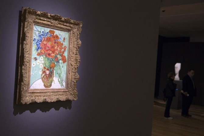 The &quot;Still Life, Vase with Daisies, and Poppies&quot; by Vincent Van Gogh from 1890 is seen during a media preview at Sotheby's auction house in New York, October 31, 2014.
