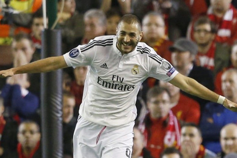 Real Madrid's Karim Benzema celebrates after scoring the second goal against Liverpool during their Champions League Group B soccer match at Anfield in Liverpool, northern England October 22, 2014.
