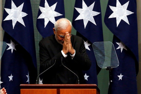 India&#039;s Prime Minister Narendra Modi reacts to members of parliament after making a speech in the House of Representatives in Australia&#039;s Parliament House in Canberra