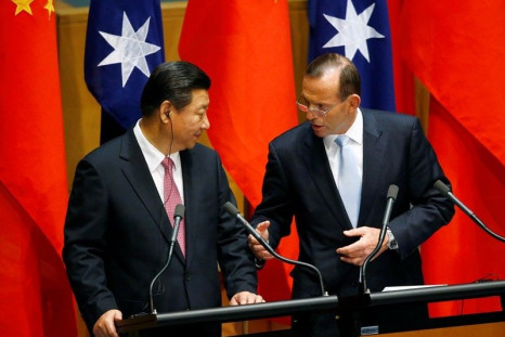China's President Xi Jinping (L) And Australia's Prime Minister Tony Abbott 