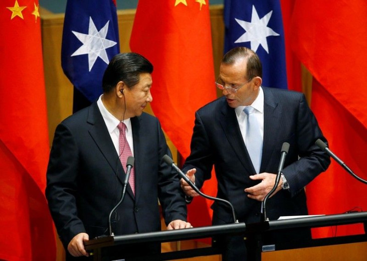 China's President Xi Jinping (L) And Australia's Prime Minister Tony Abbott 