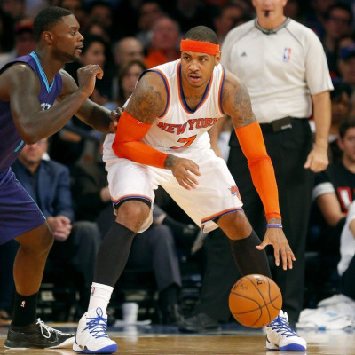 New York Knicks forward Carmelo Anthony (7) works against Charlotte Hornets guard Lance Stephenson (1) during the first half at Madison Square Garden.