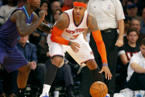 New York Knicks forward Carmelo Anthony (7) works against Charlotte Hornets guard Lance Stephenson (1) during the first half at Madison Square Garden.