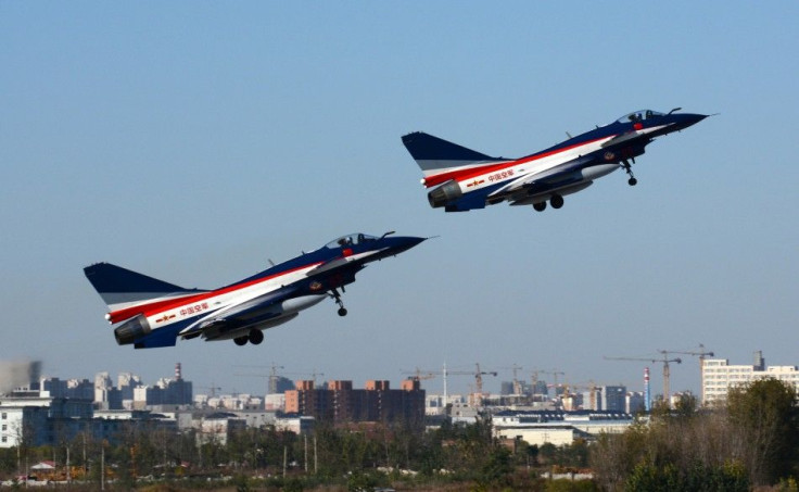 J-10 fighter jets from the August 1st Aerobatics Team of the People's Liberation Army Air Force take off from a military base as they travel to Zhuhai for the upcoming China International Aviation & Aerospace Exhibition, in Tianjin municipality, Nove