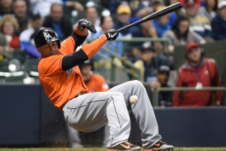 Sep 11, 2014; Milwaukee, WI, USA; Miami Marlins right fielder Giancarlo Stanton (27) is hit by a pitch in the fifth inning and had to leave the game against the Milwaukee Brewers at Miller Park.