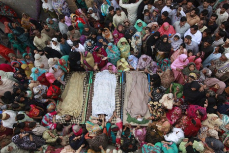 Relatives gather beside the bodies of victims who were killed in yesterday&#039;s suicide bomb attack on the Wagah border, before funeral prayers in Lahore November 3, 2014.