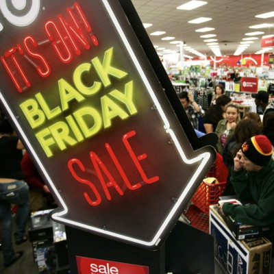 People shop at Target on Thanksgiving Day in Burbank, California November 22, 2012. The shopping frenzy known as &quot;Black Friday&quot; kicked off at a more civilized hour welcomed by some shoppers this year, with retailers like Target Corp and Toys R U