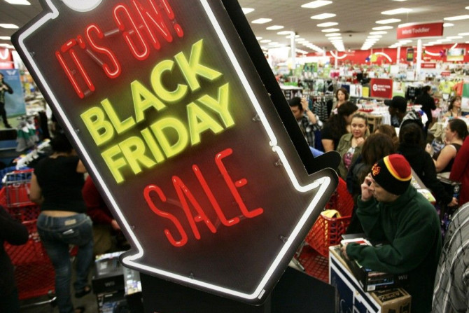 People shop at Target on Thanksgiving Day in Burbank, California November 22, 2012. The shopping frenzy known as &quot;Black Friday&quot; kicked off at a more civilized hour welcomed by some shoppers this year, with retailers like Target Corp and Toys R U