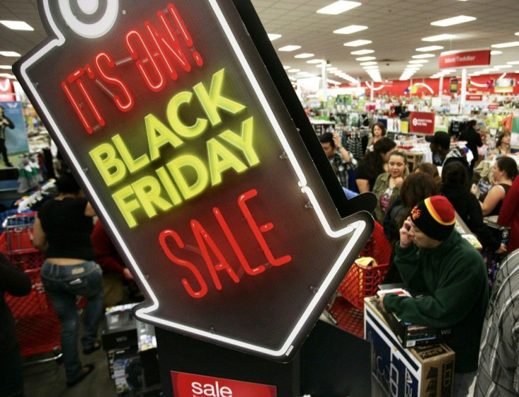 People shop at Target on Thanksgiving Day in Burbank, California November 22, 2012. The shopping frenzy known as &quot;Black Friday&quot; kicked off at a more civilized hour welcomed by some shoppers this year, with retailers like Target Corp and Toys R U