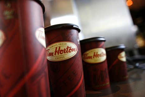 A row of Tim Hortons coffee cups are lined up for customers at Penn Station in New York, July 13, 2009. Tim Hortons Inc. today began serving its coffee, baked goods and soups and sandwiches for the first time in New York. REUTERS/Brendan McDermid