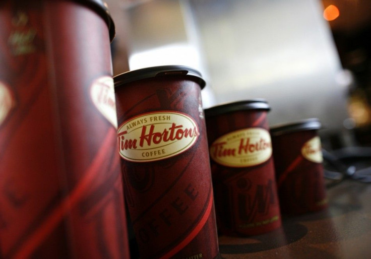 A row of Tim Hortons coffee cups are lined up for customers at Penn Station in New York, July 13, 2009. Tim Hortons Inc. today began serving its coffee, baked goods and soups and sandwiches for the first time in New York. REUTERS/Brendan McDermid